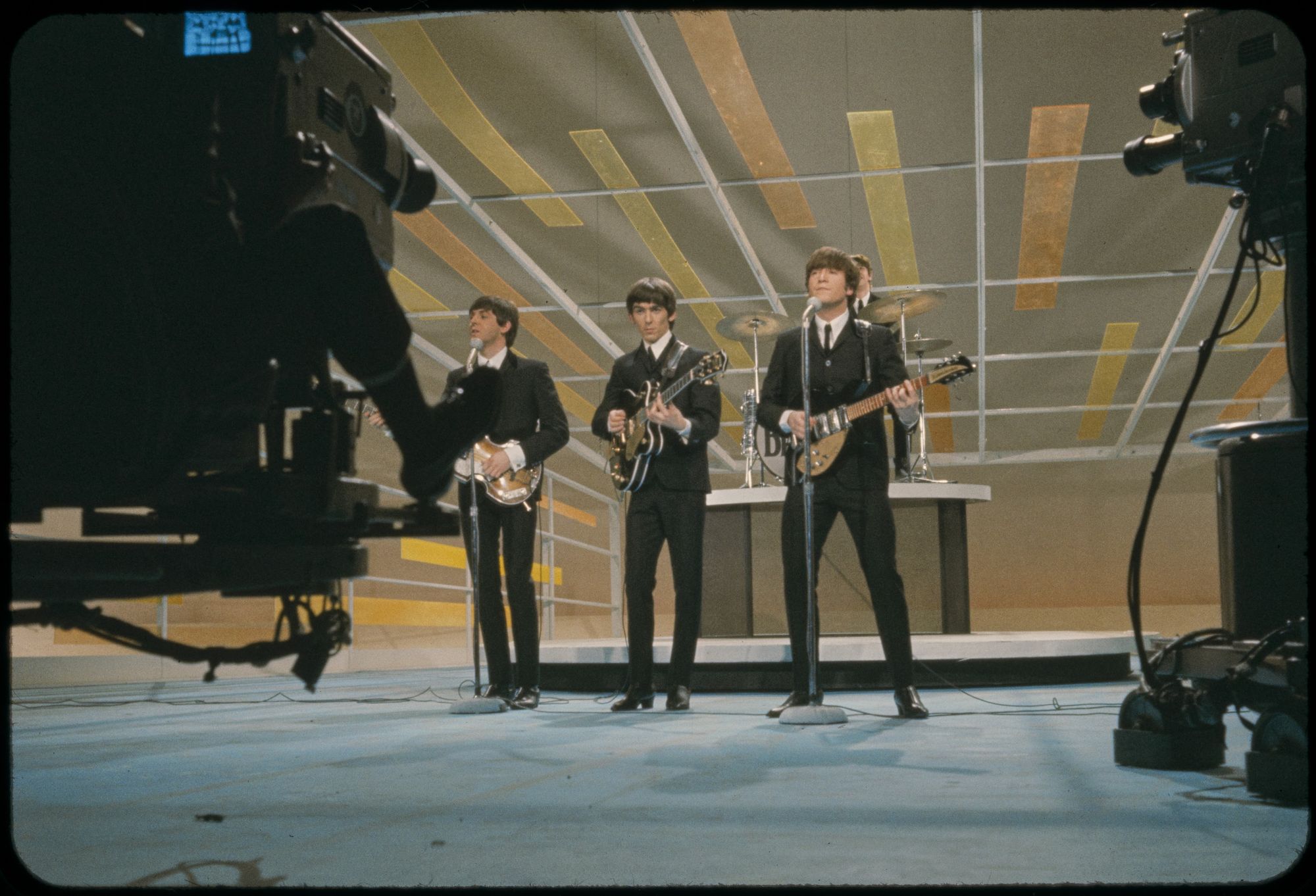 THE BEATLES PERFORMING ON THE ED SULLIVAN SHOW IN 1964