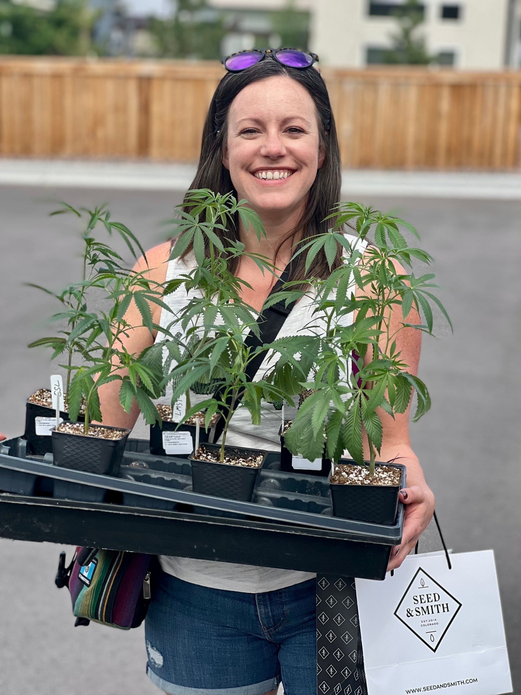 Tiney Ricciardi with cannabis plant from Seed & Smith